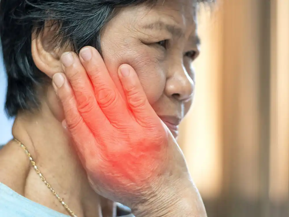 TMJ woman in pain hand is showing irritation duplicate photo