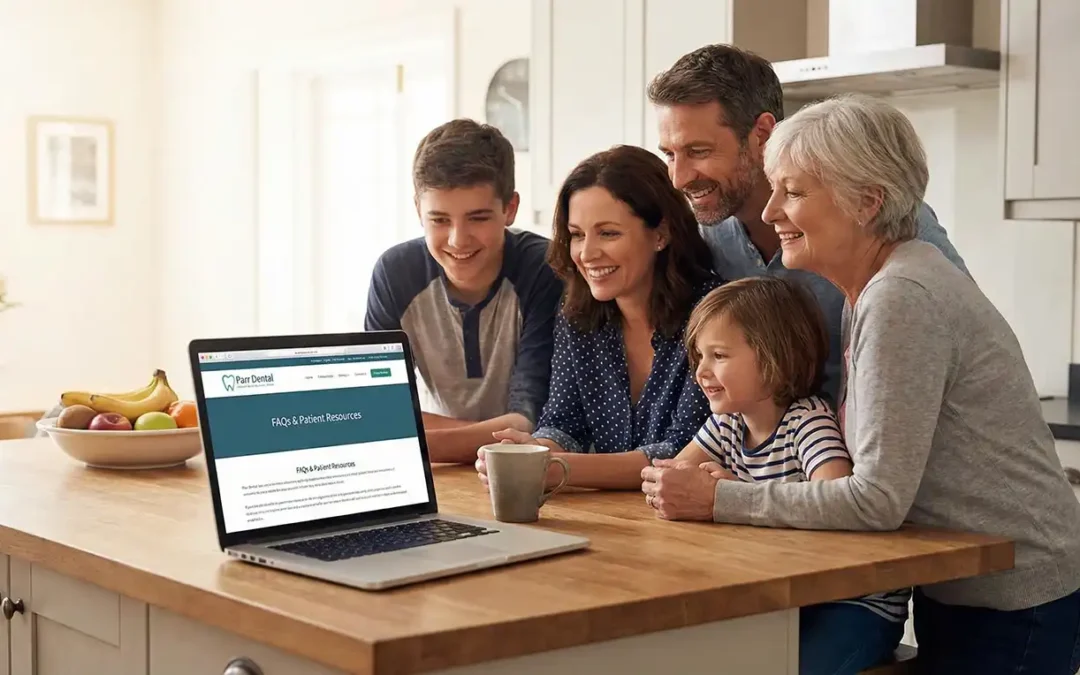Smiling family of four in a kitchen looking at the Parr Dental website on a laptop, reviewing new patient FAQs and dental membership plans in Omaha."