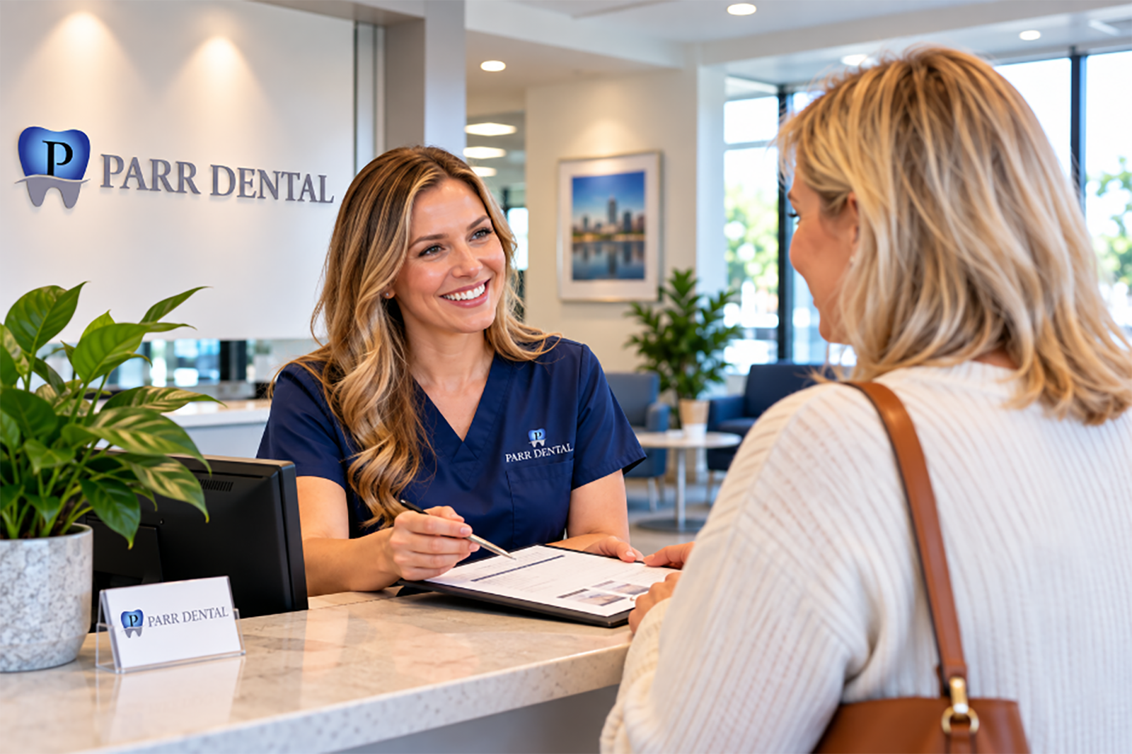 A friendly team member at Parr Dental answering patient questions and providing a welcoming experience in Omaha.
